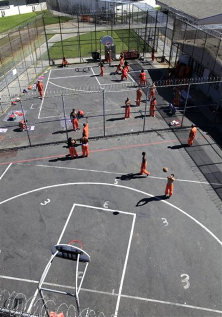 Sacramento County inmates are in the exercise yard at the Rio Cosumnes Correctional Center, in Elk Grove, Calif. In a prison realignment plan championed by Gov. Jerry Brown, judges may send non-violent, lower level offenders to county jails for crimes such as property, white collar and drug offenses instead of to state prisons.